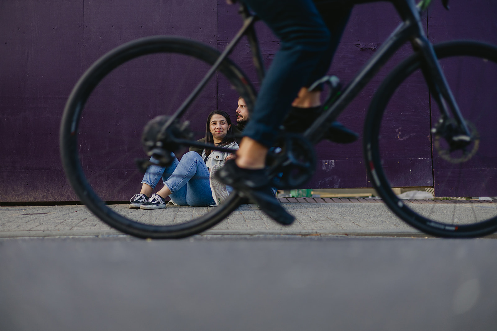 couple portrait while bicycle crossing