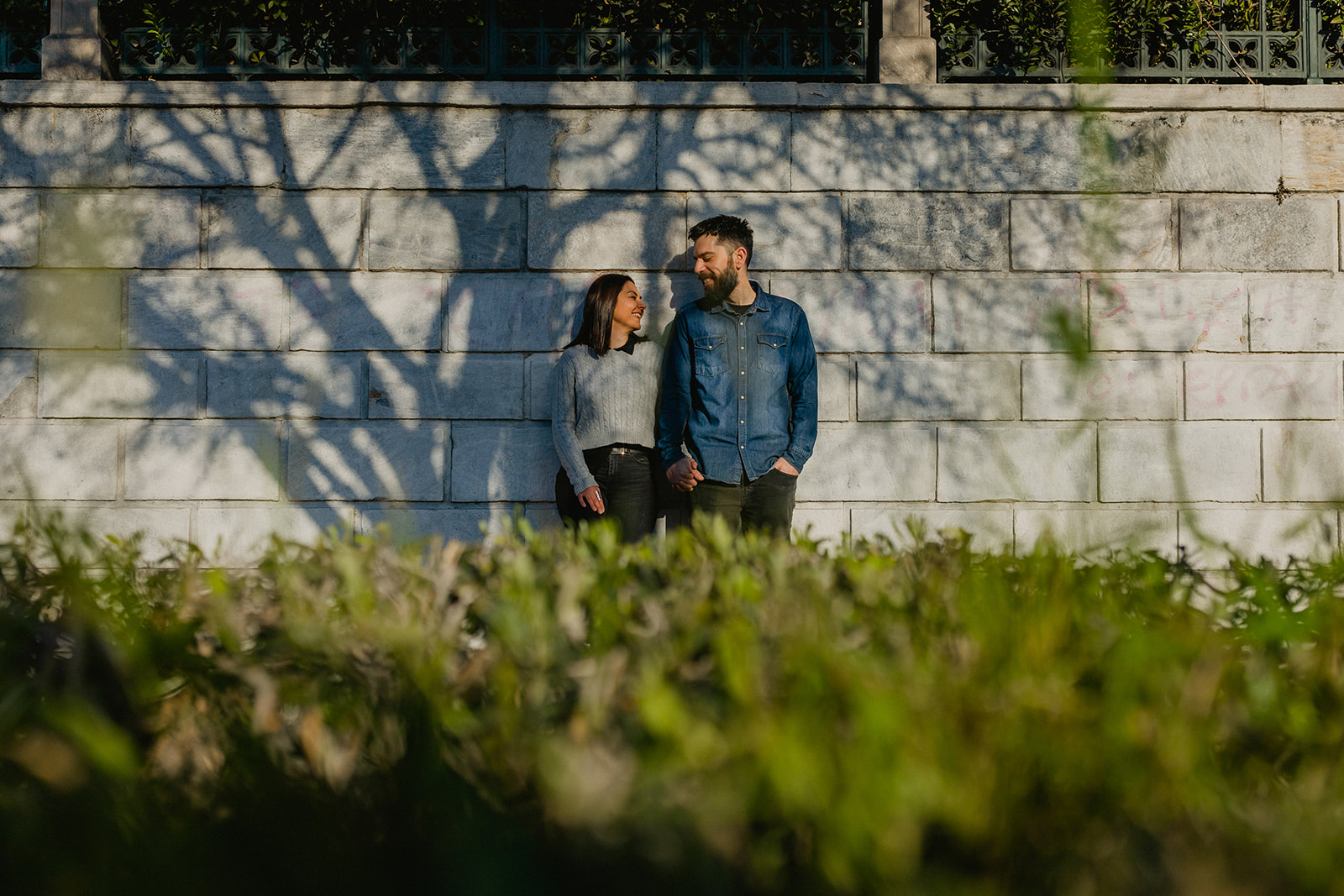 Couple portrait under the tree shadow